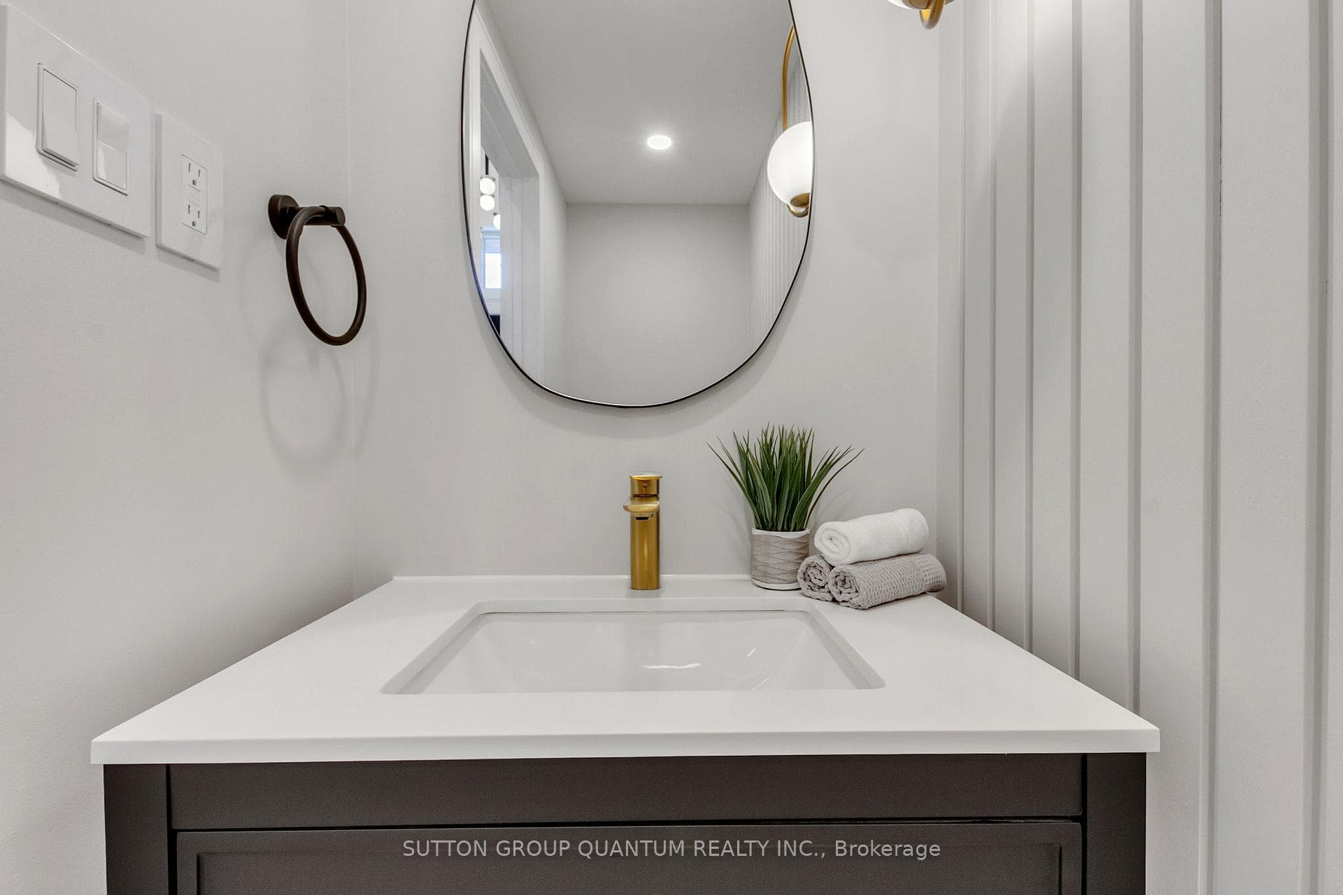 Designer inspired powder room with wall panel