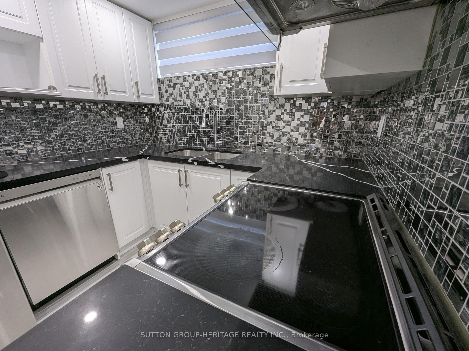 Kitchen with Quartz Counter Top and Backspalsh