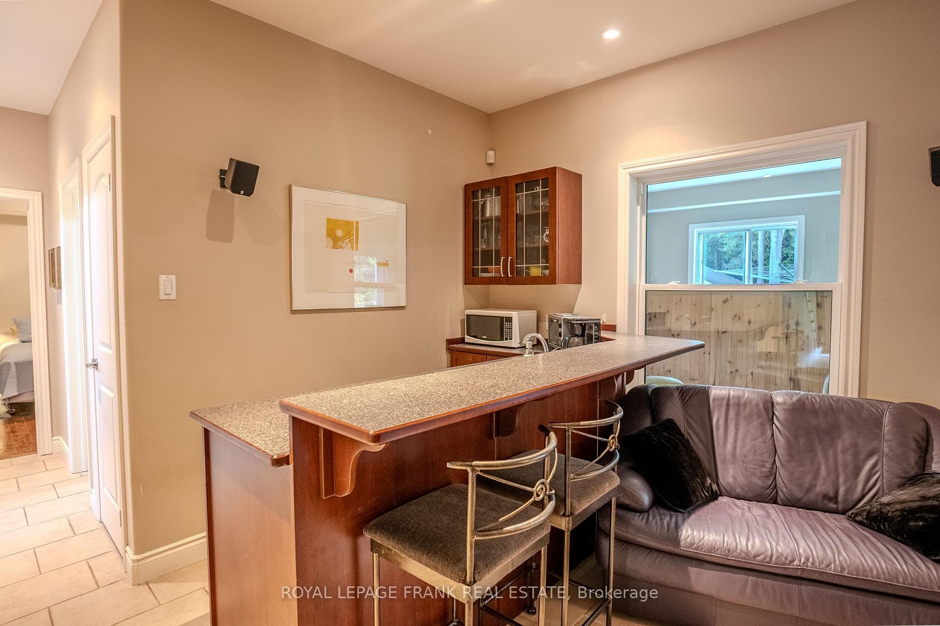 Bar with sink, fridge and cupboards