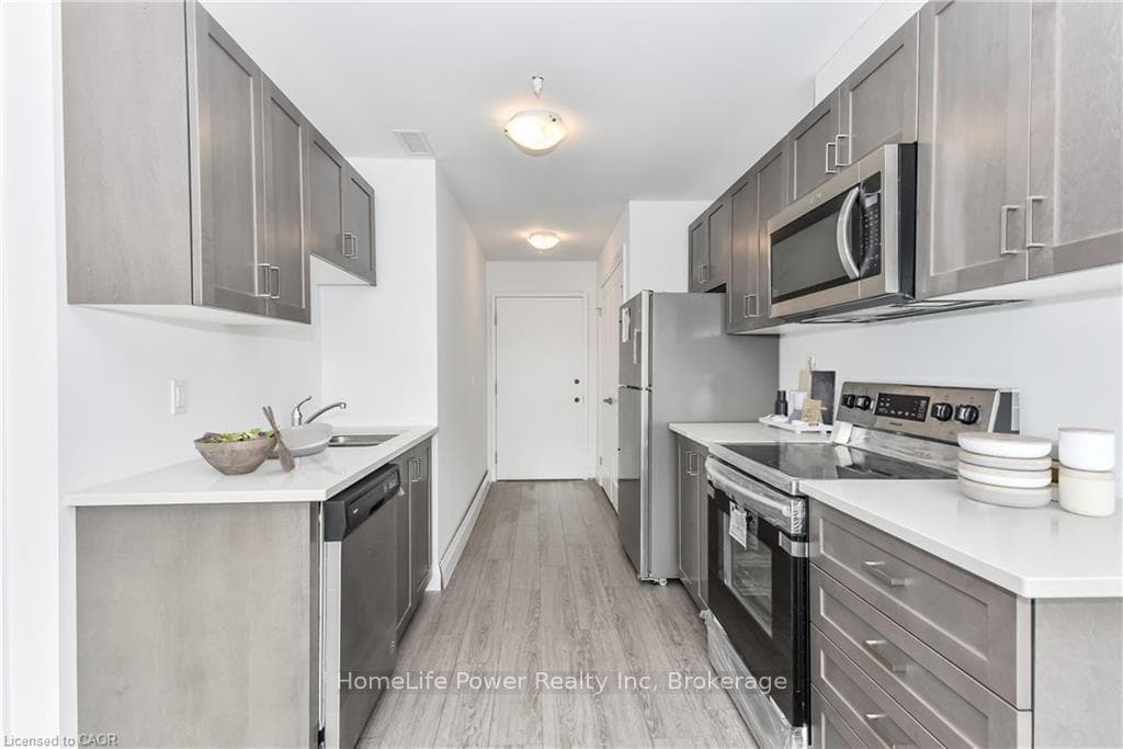Galley kitchen (Virtually Staged)