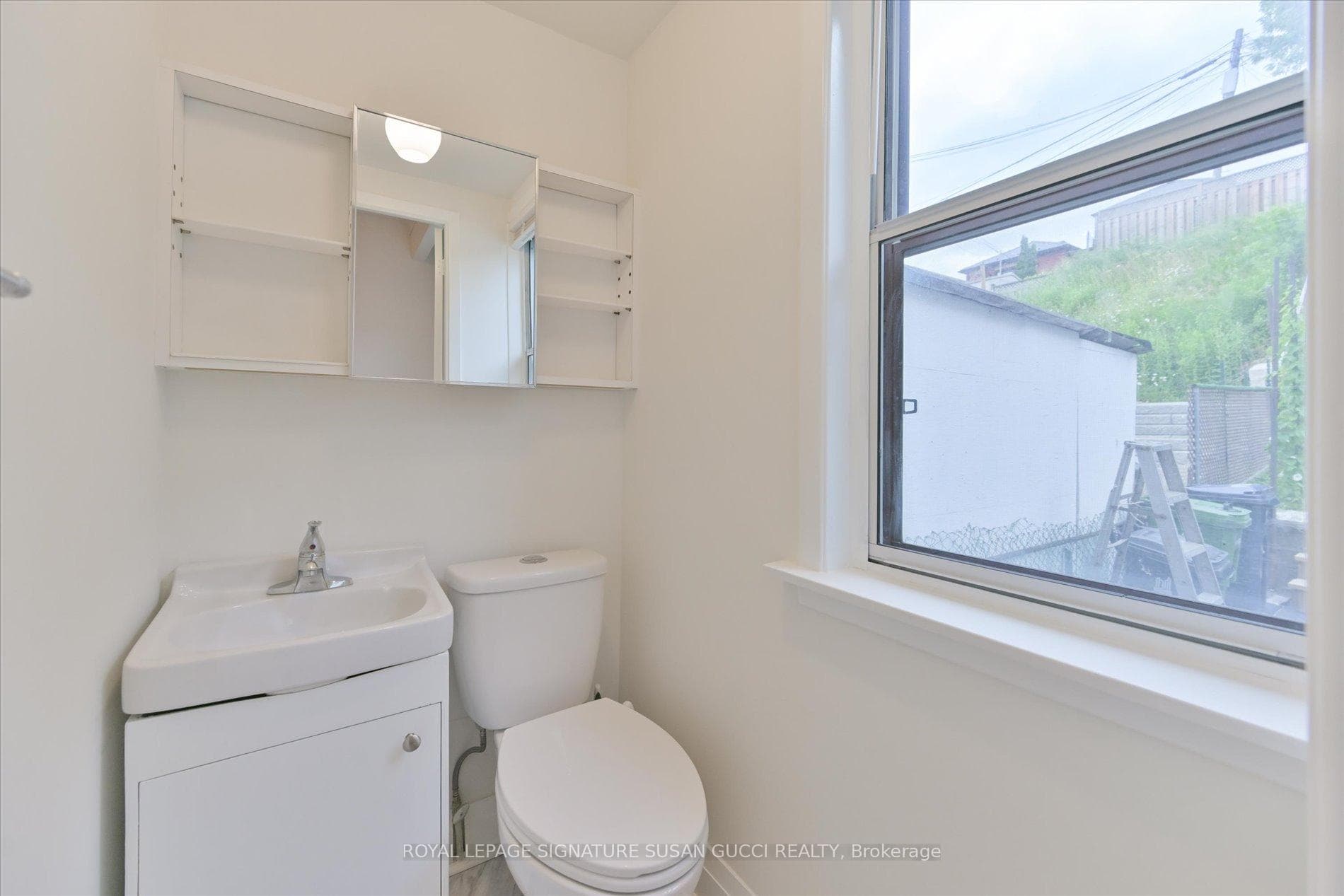 Main floor powder room - rare for area