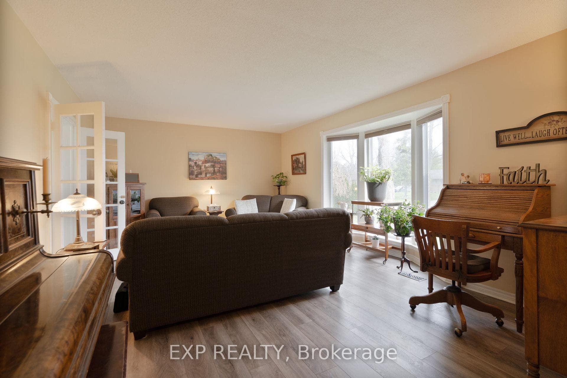 Living room with bay window, doubles as a studio.