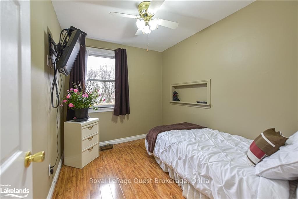 Bedroom featuring light hardwood / wood-style floo