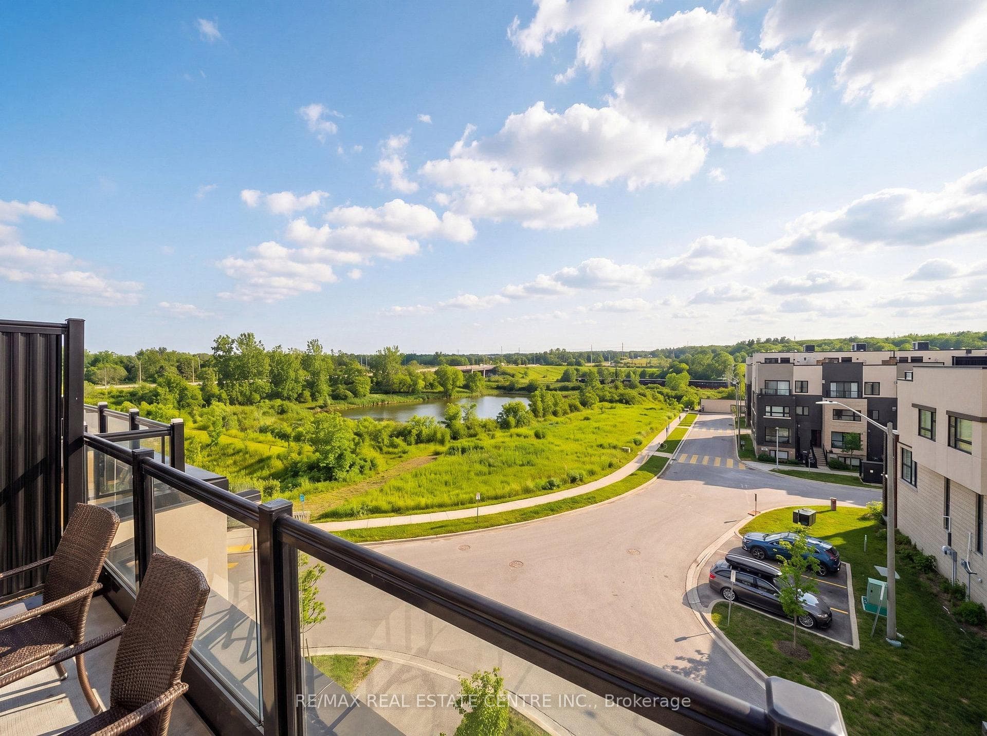 Expansive views of greenspace & pond from rooftop