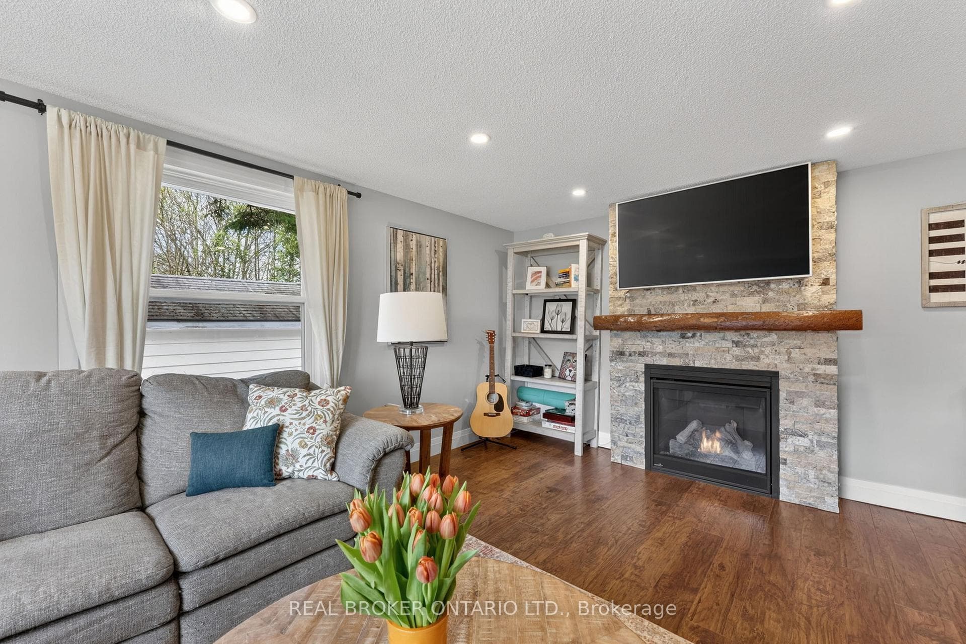 Family room w large window & gas fireplace