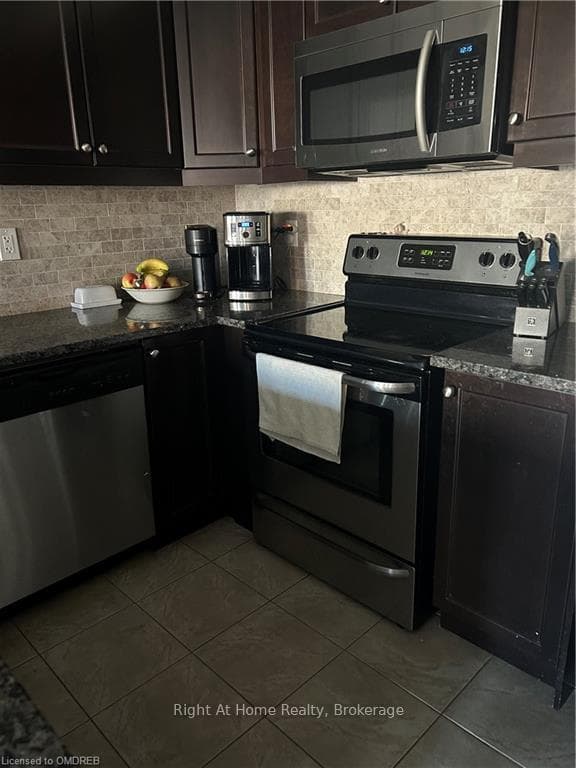 Kitchen with appliances with stainless steel finis