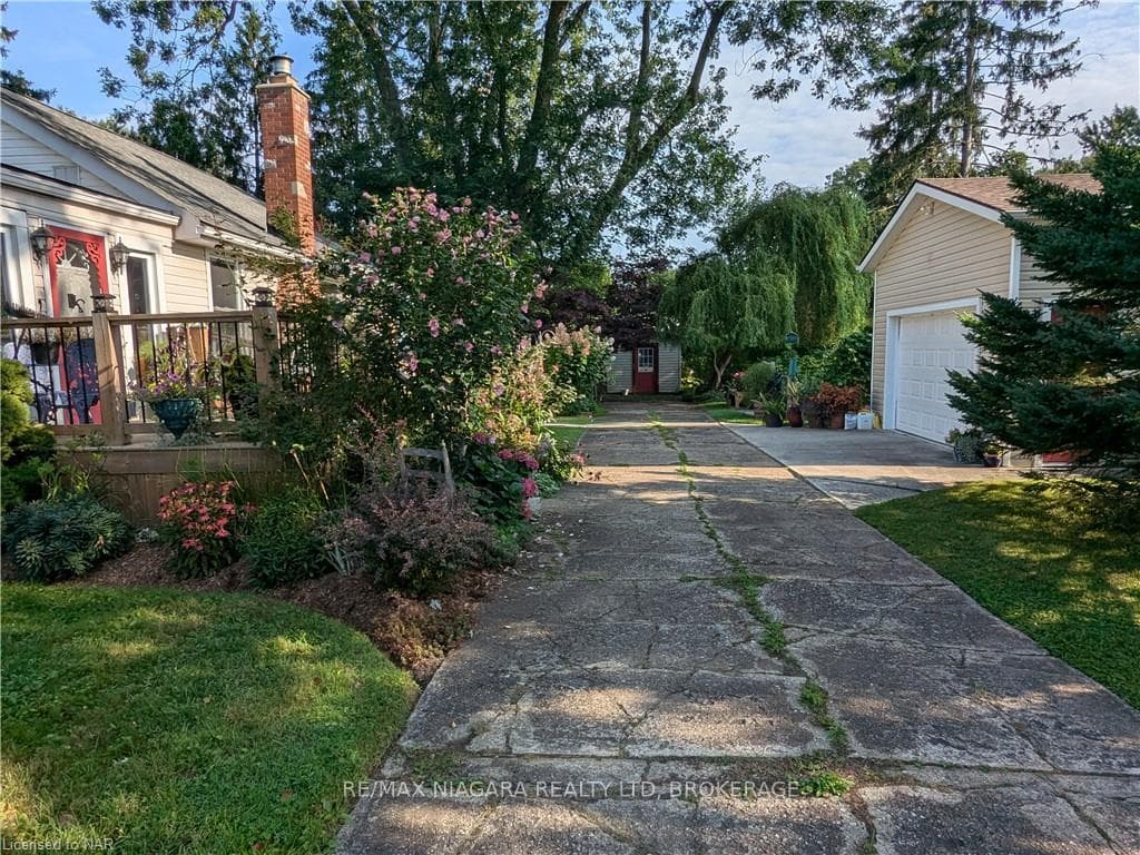 Parking for several with handy garage and shed