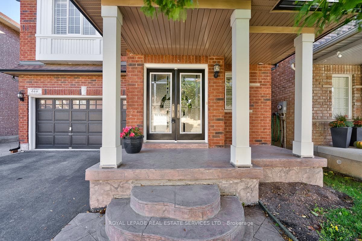 Covered Porch and Elegant Double Entrance Doors