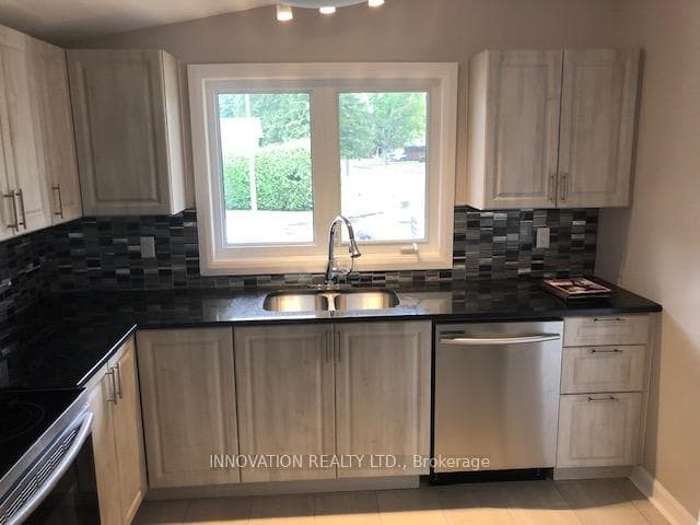 Main level kitchen with stainless appliances