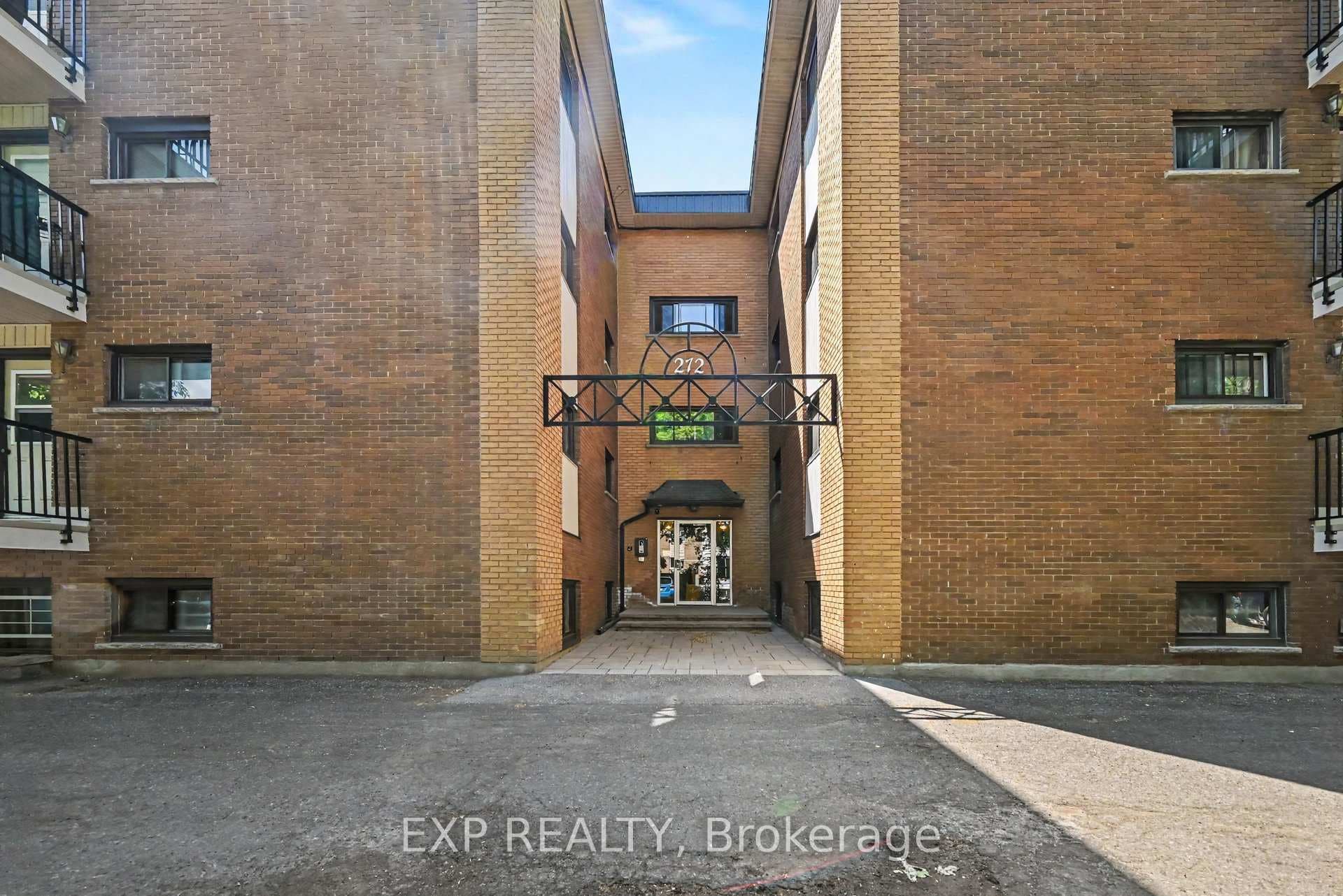 Entrance & parking located at rear of the building