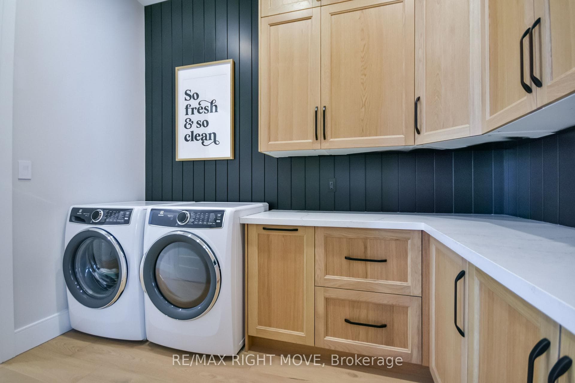 Laundry is accessed 2 ways w/ plenty of storage