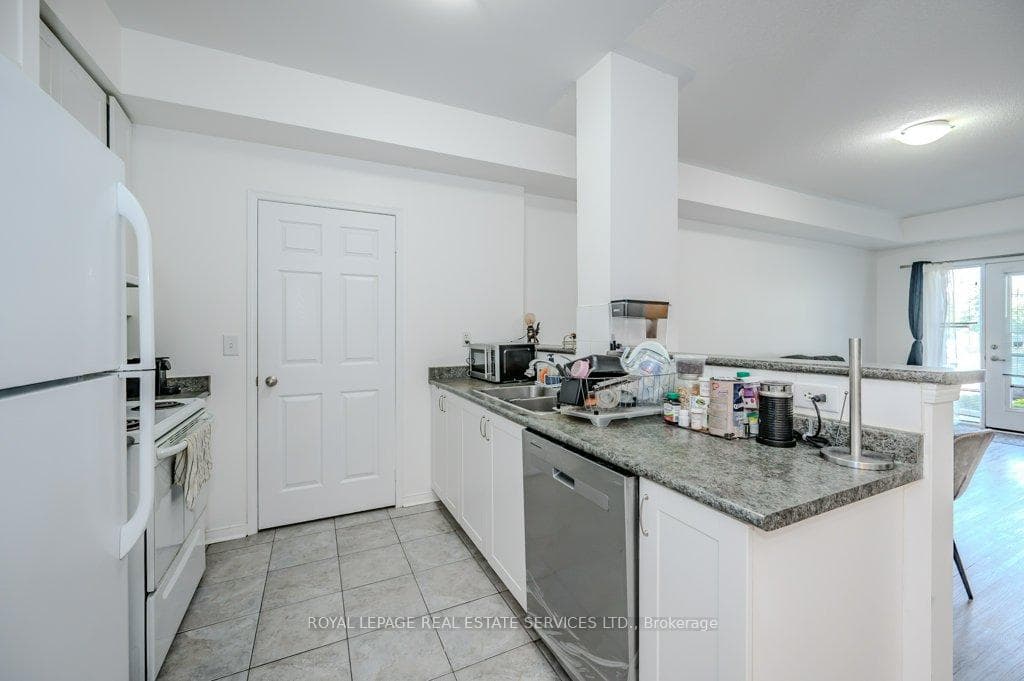 Spacious Kitchen Overlooks the Living/Dining Area