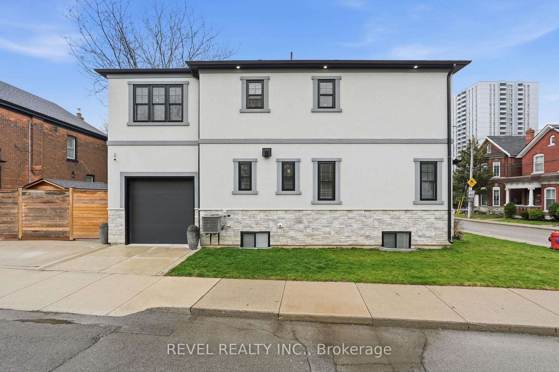 side view with attached garage & concrete driveway