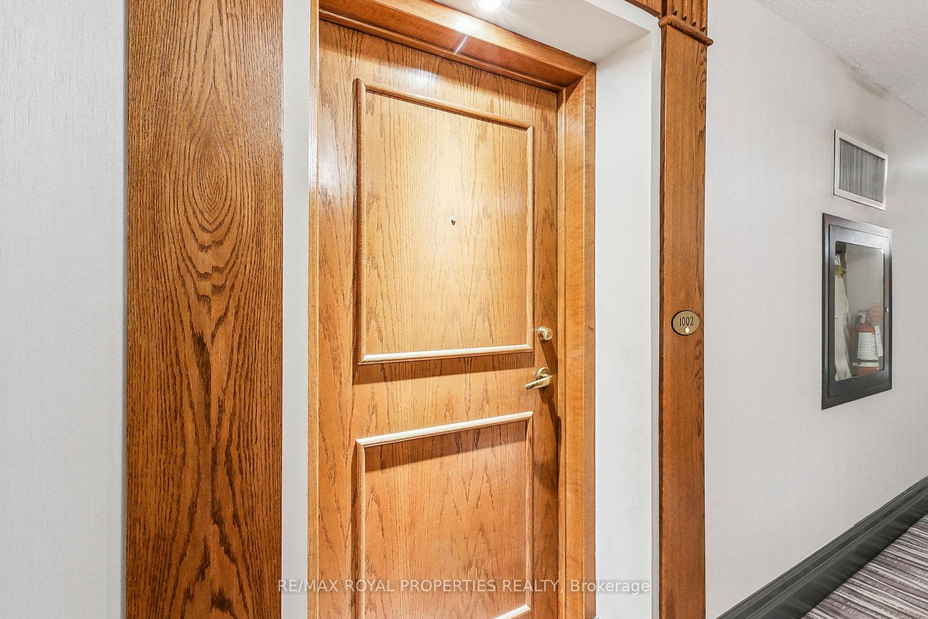Built-In Doorbell And Beautiful Wood Door