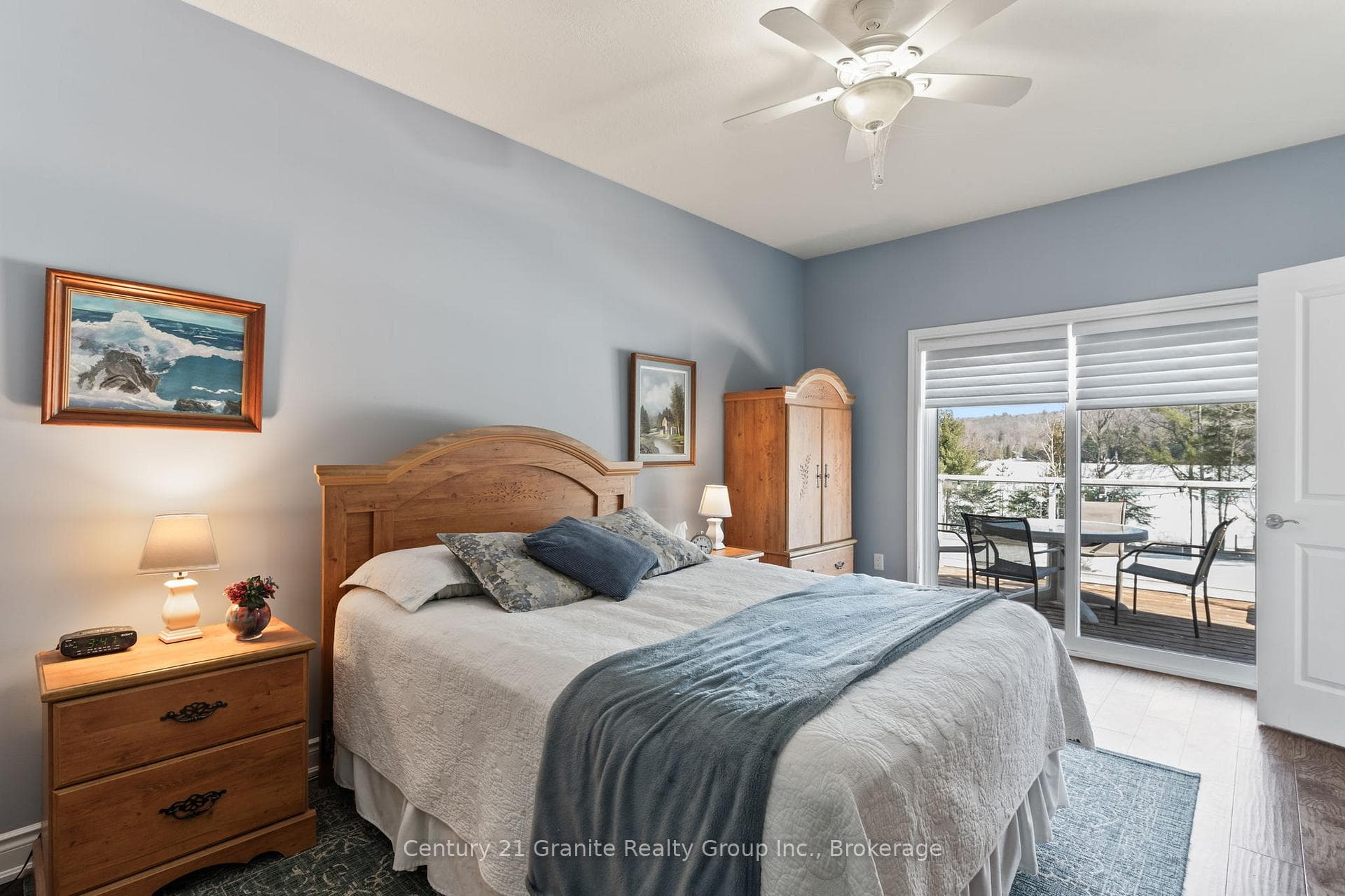 Primary bedroom w/ walkout to lakeside deck