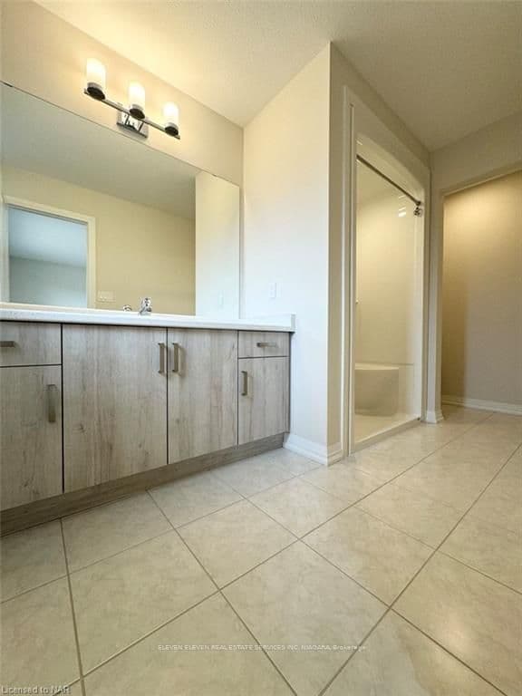 Ensuite with walk-in shower, and water closet.