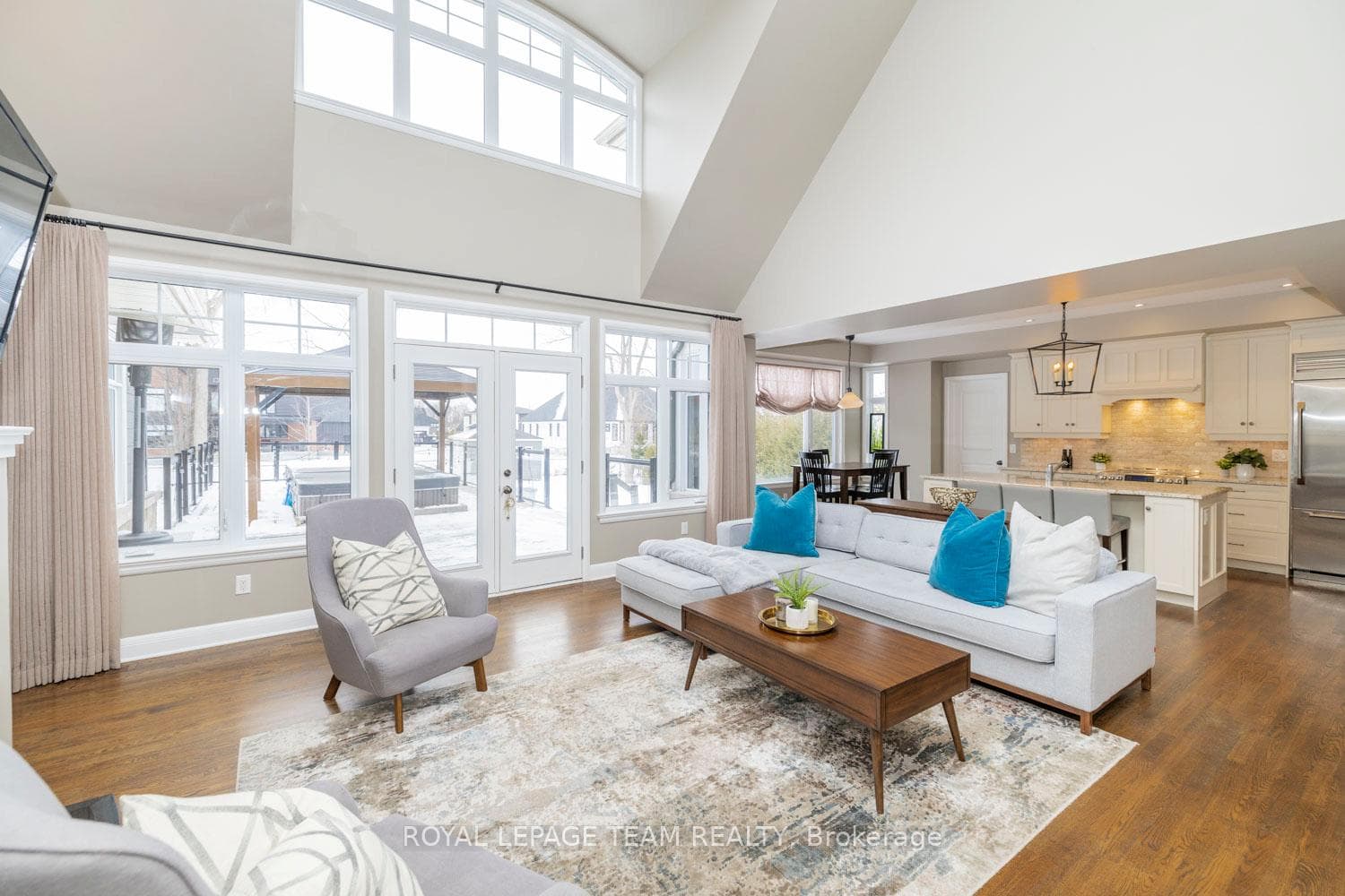 Soaring ceilings with a wall of windows.