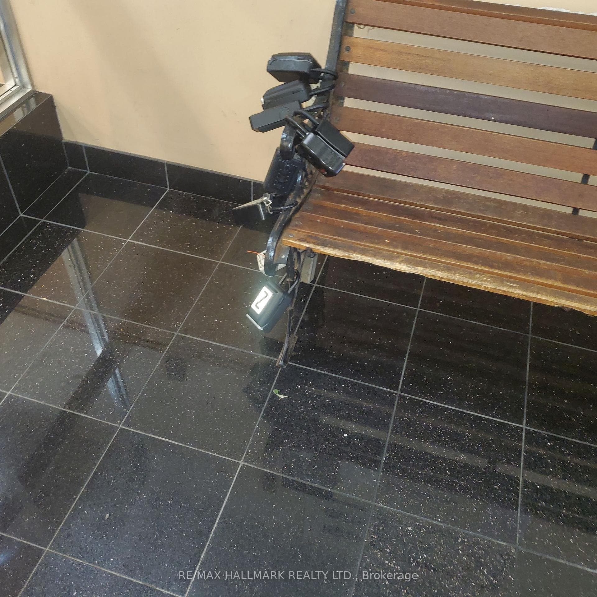 LOCKBOX ON BENCH WITH Z ON FRONT & ORNAGE ZIP TIE