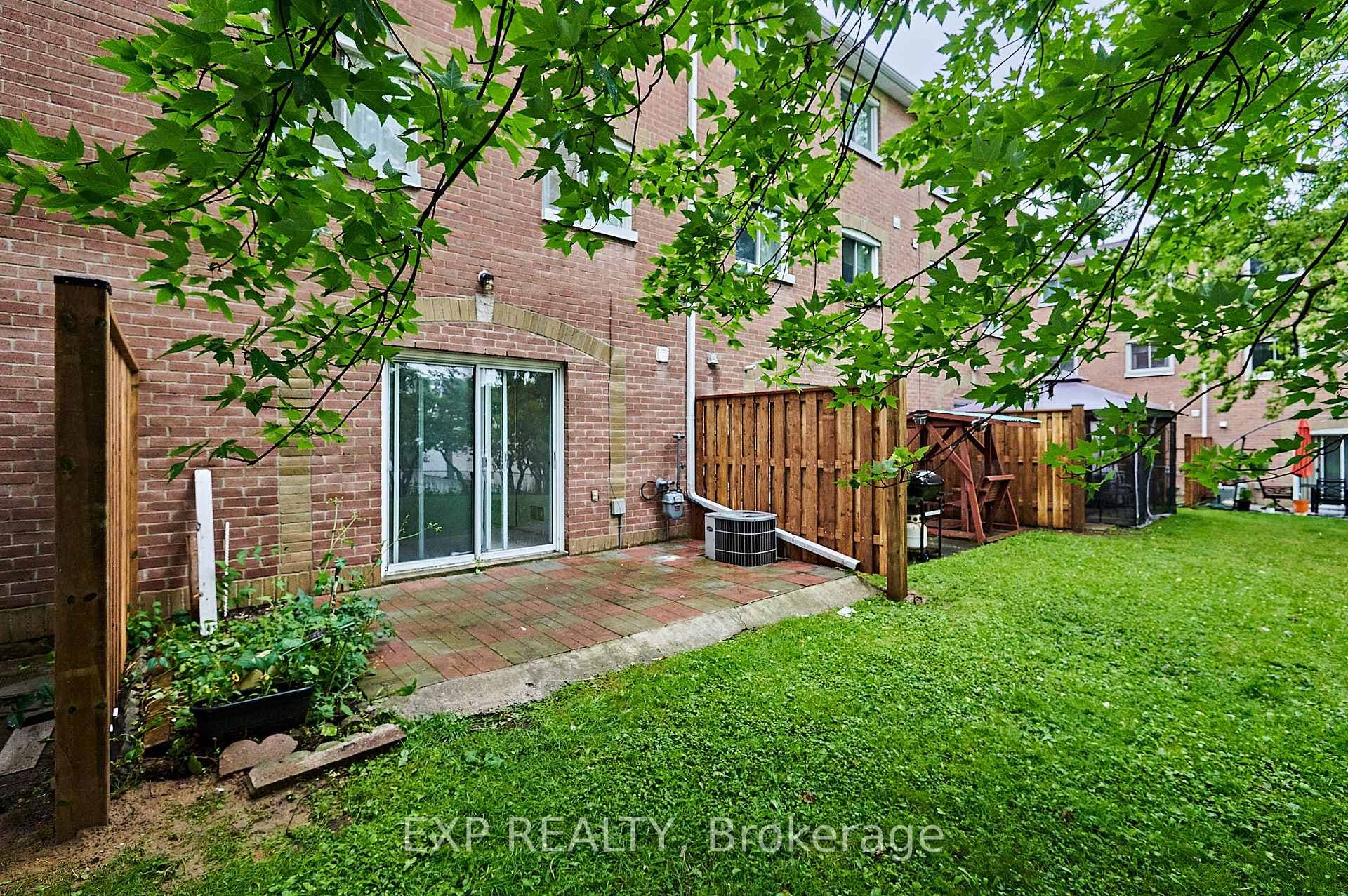Private patio and grassy backyard