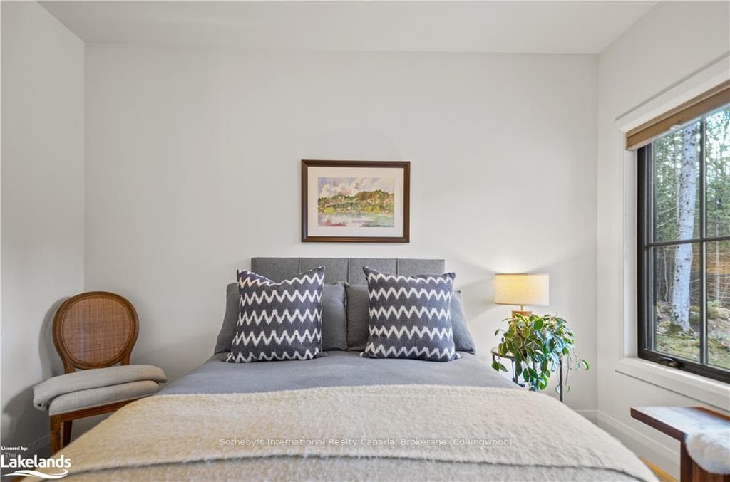 Bedroom with multiple windows