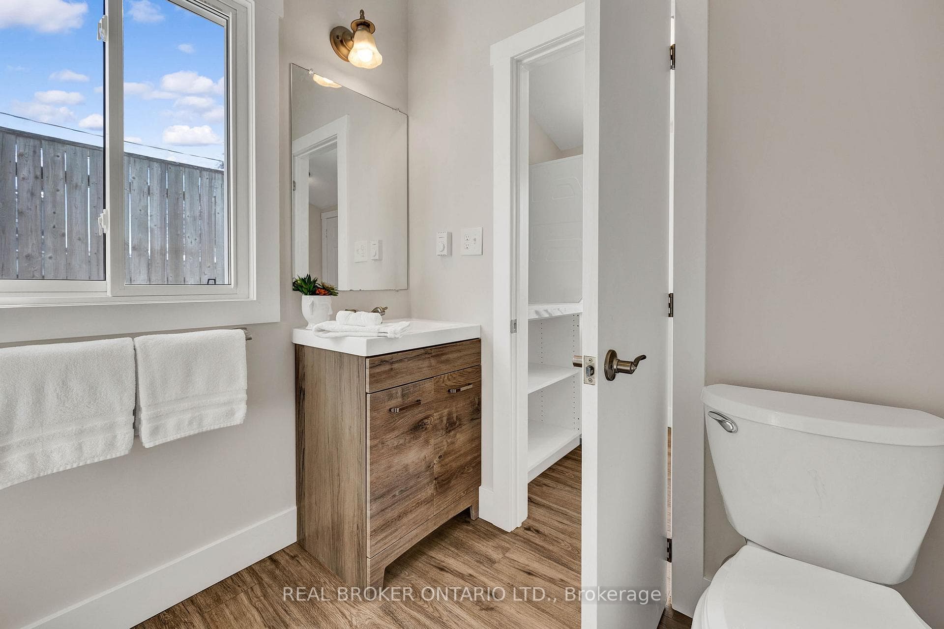 Bathroom featuring vanity / large window