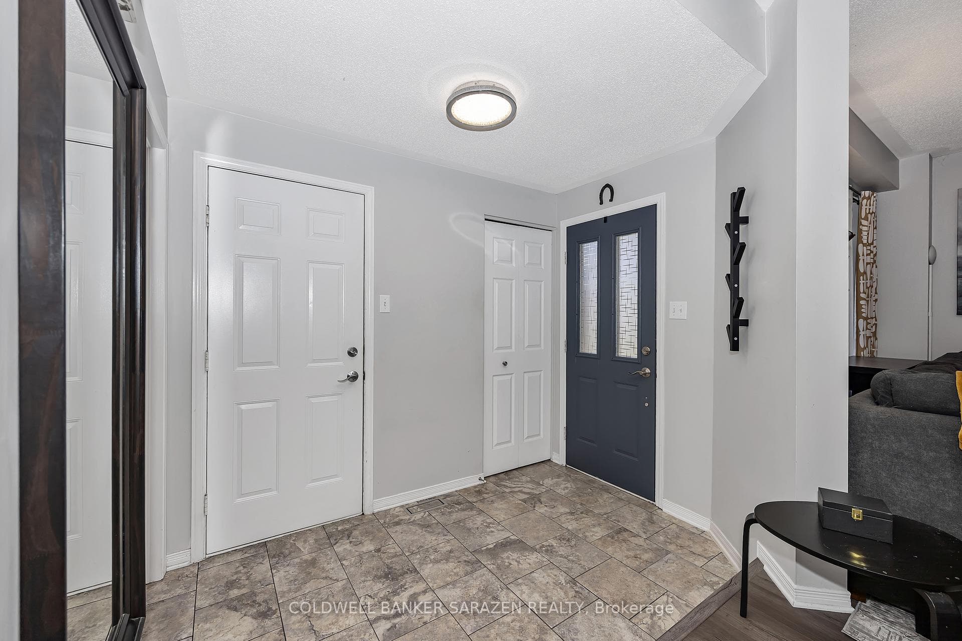 Foyer - Left door to garage, middle closet