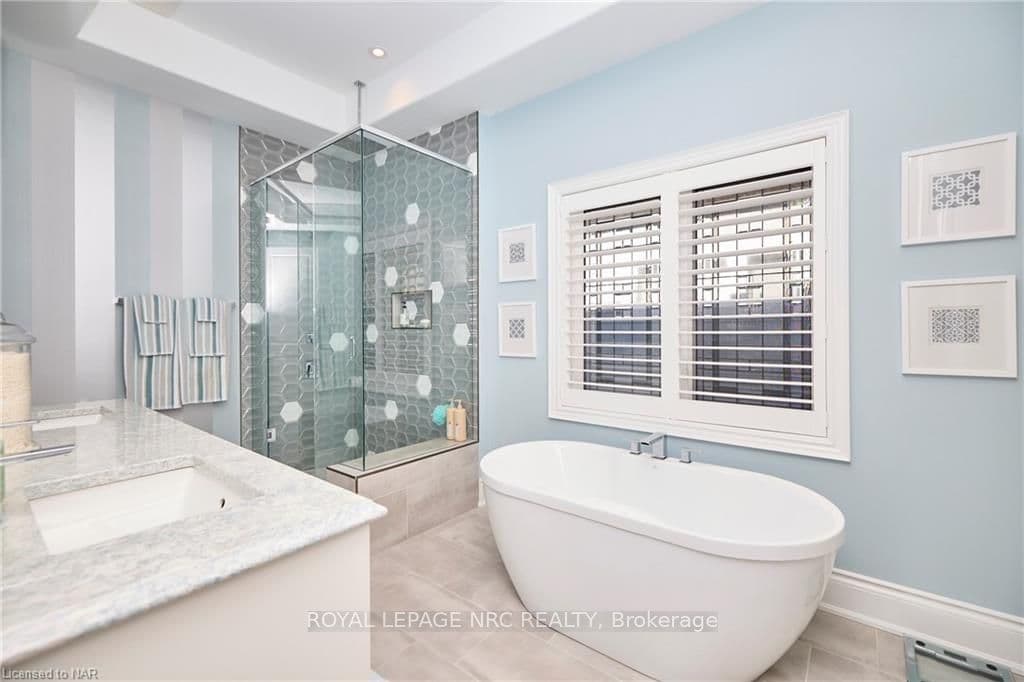 Primary bedroom ensuite with heated floors, soaker