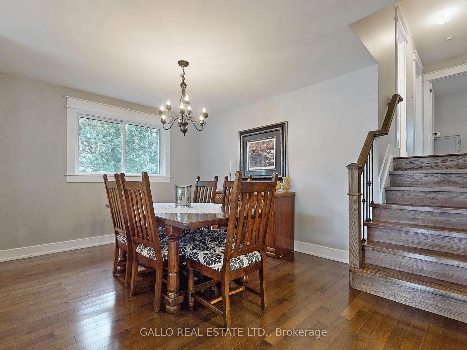 LARGE DINING AREA-WROUGHT IRON STAIRCASE
