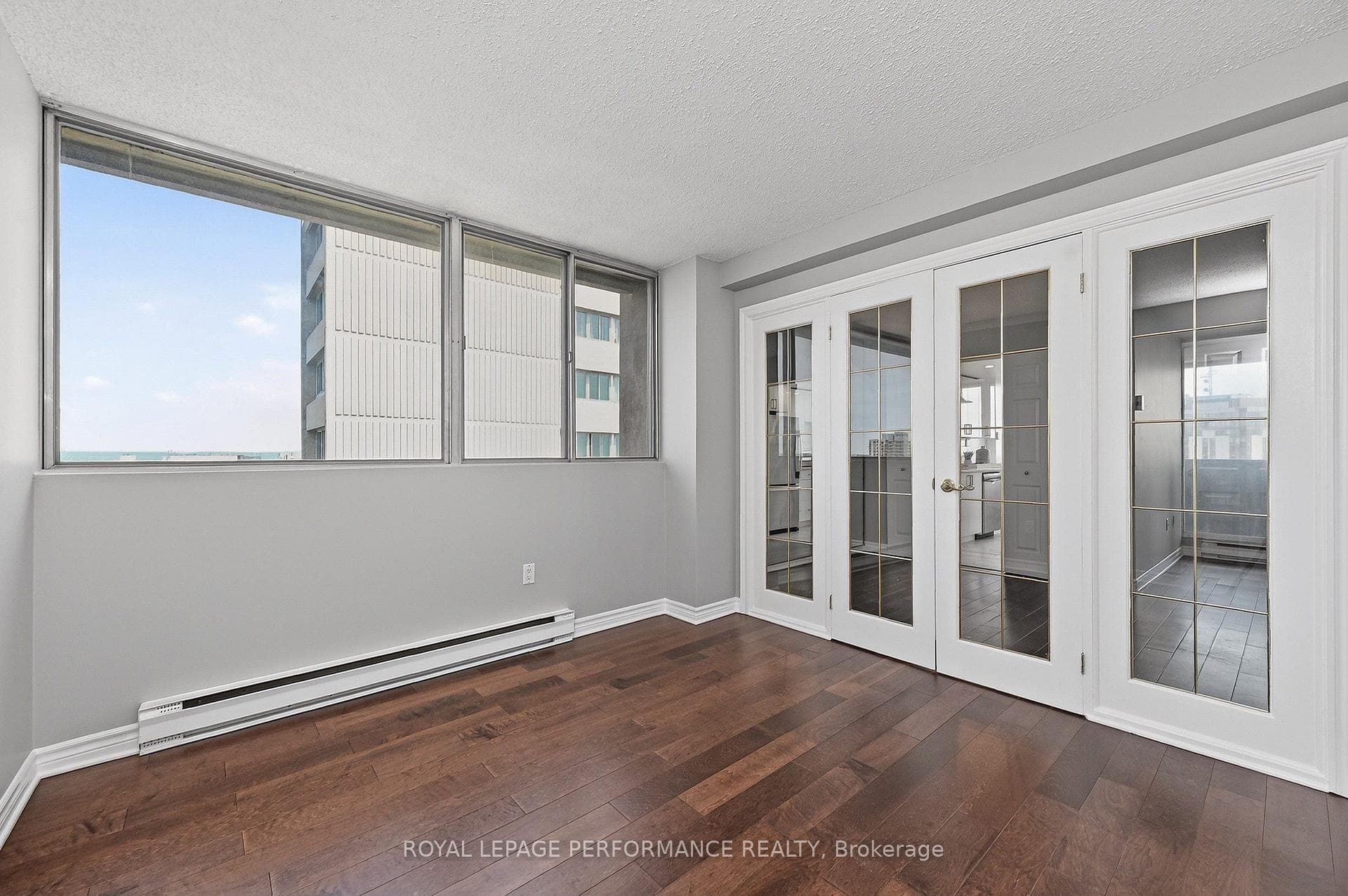 Bedroom/den with doors to living area