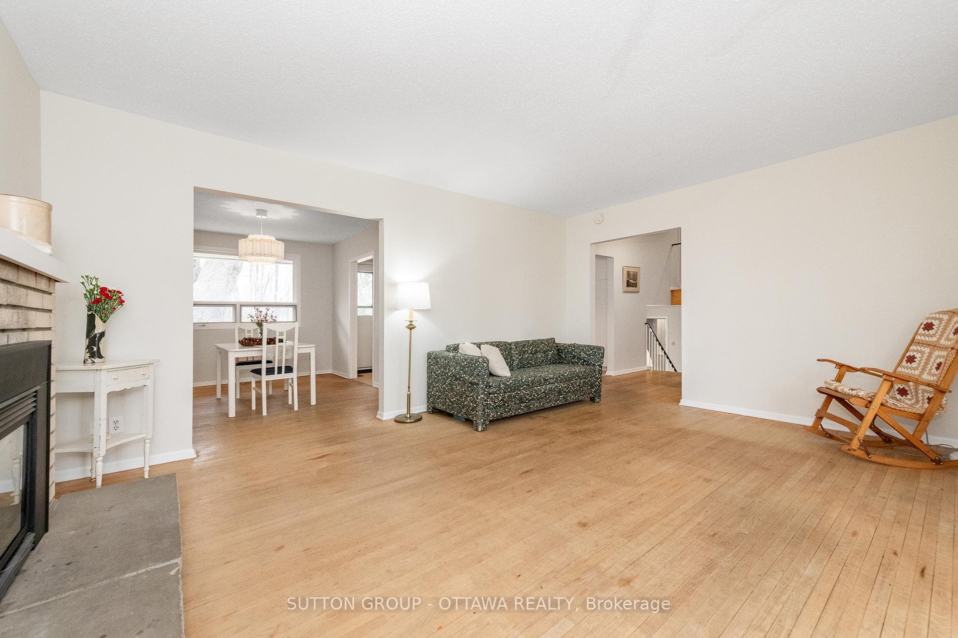 living room with dining room and front foyer area