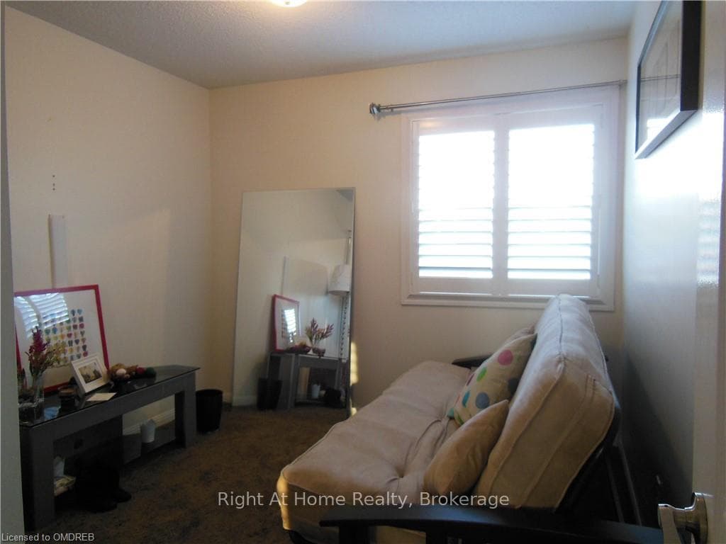 Bedroom featuring dark carpet