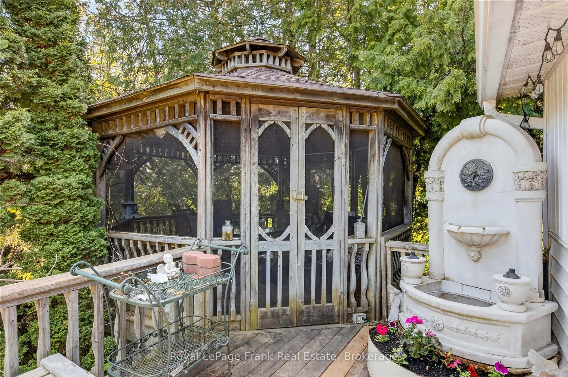 Screened gazebo on deck for evening dinners