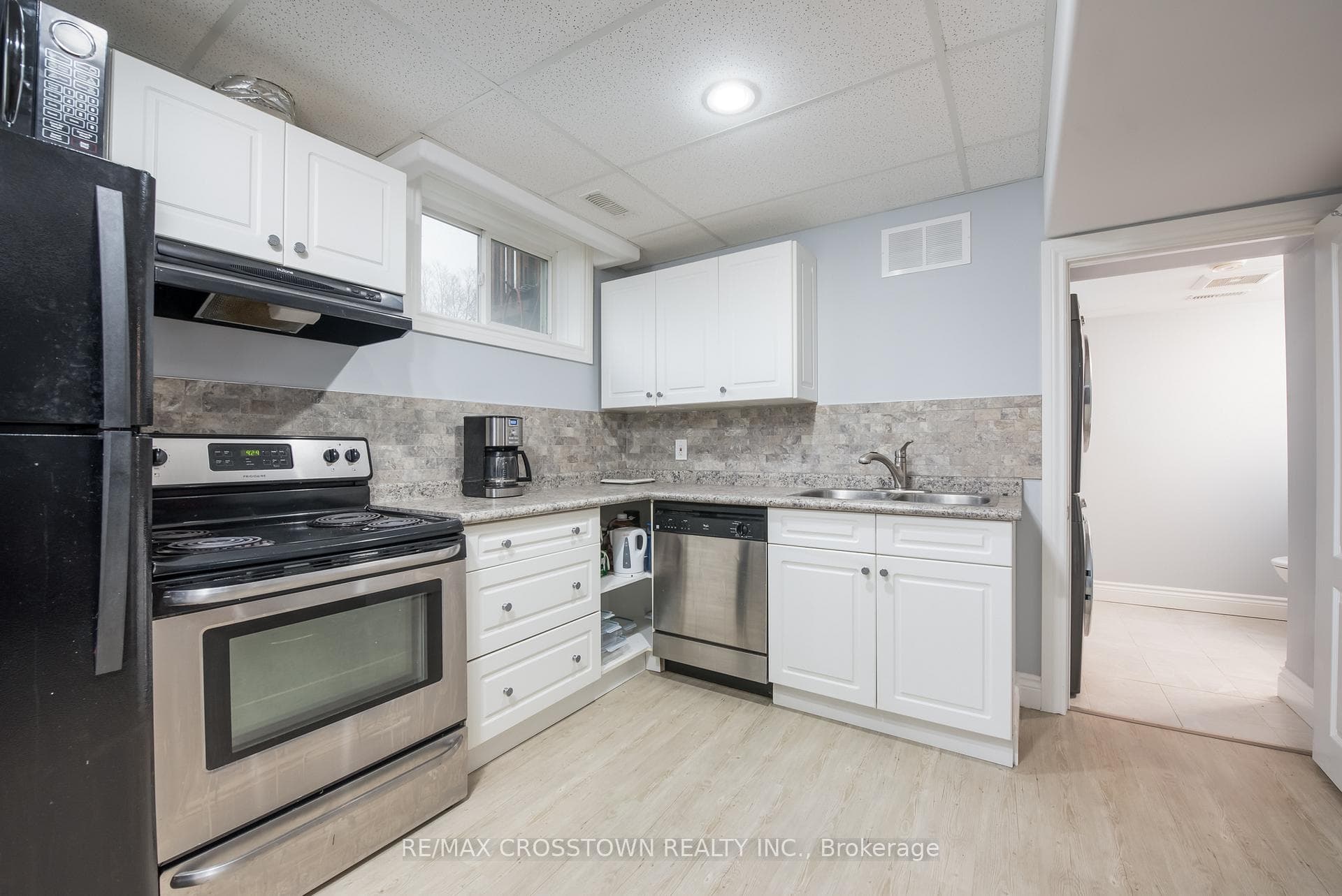 Bright white kitchen with dishwasher