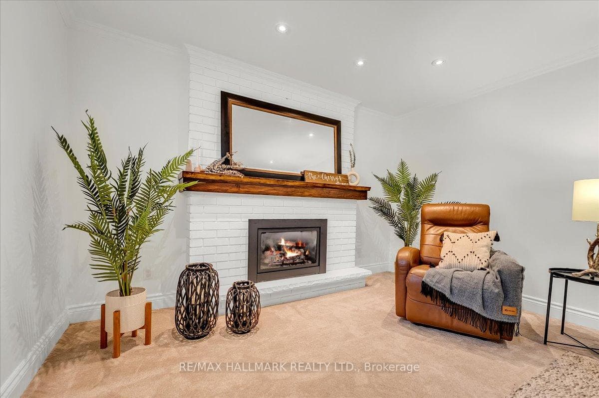 Cozy gas fireplace with gorgeous custom mantle
