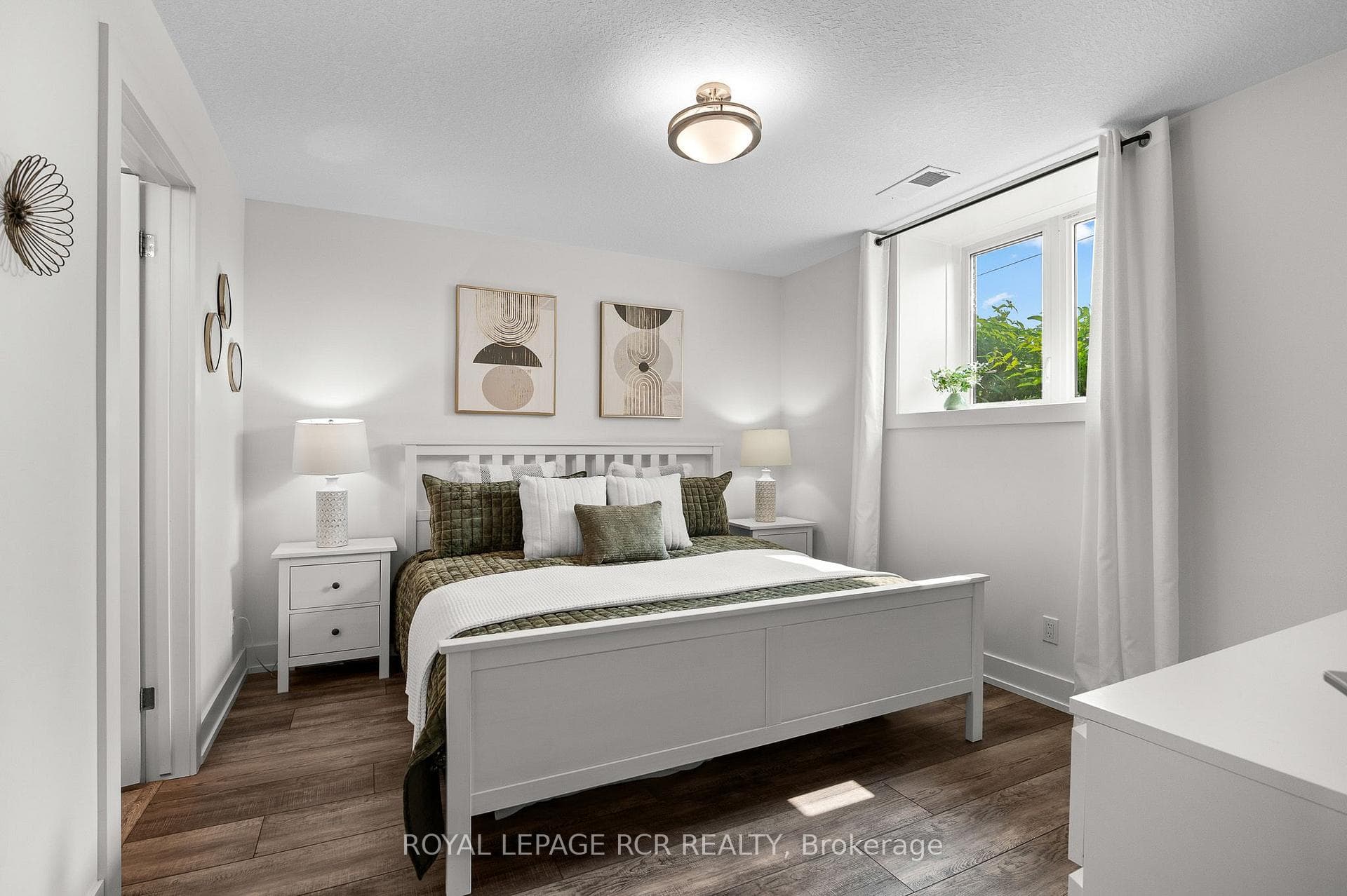 Primary bedroom with large window