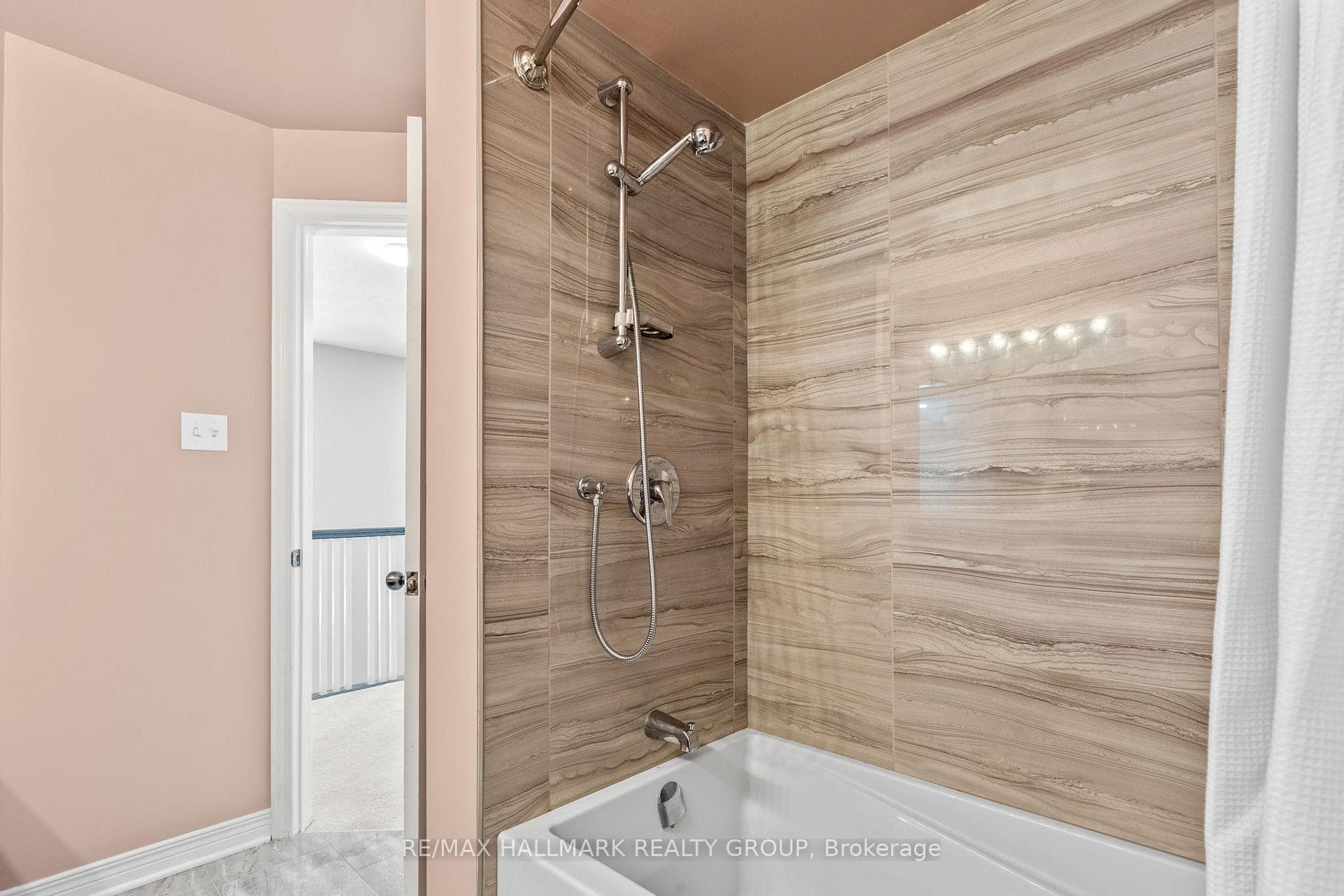 Second level full bathroom with tiled shower