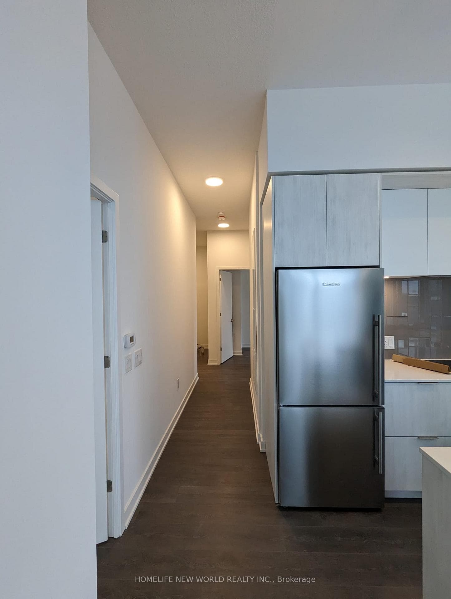 Hallway to front door & 2 bedrooms & Den.