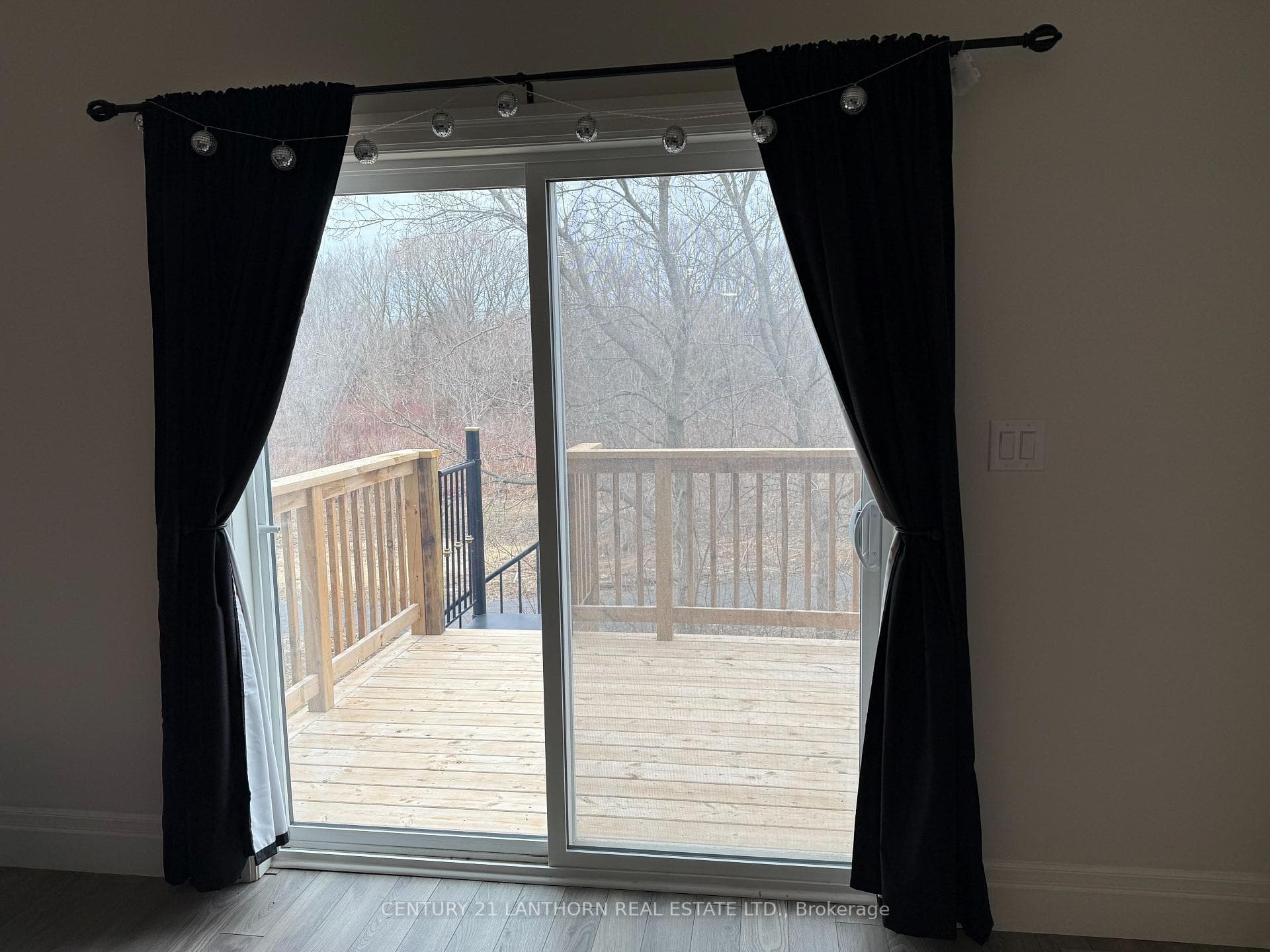 Sliding glass doors to deck; stairs to backyard