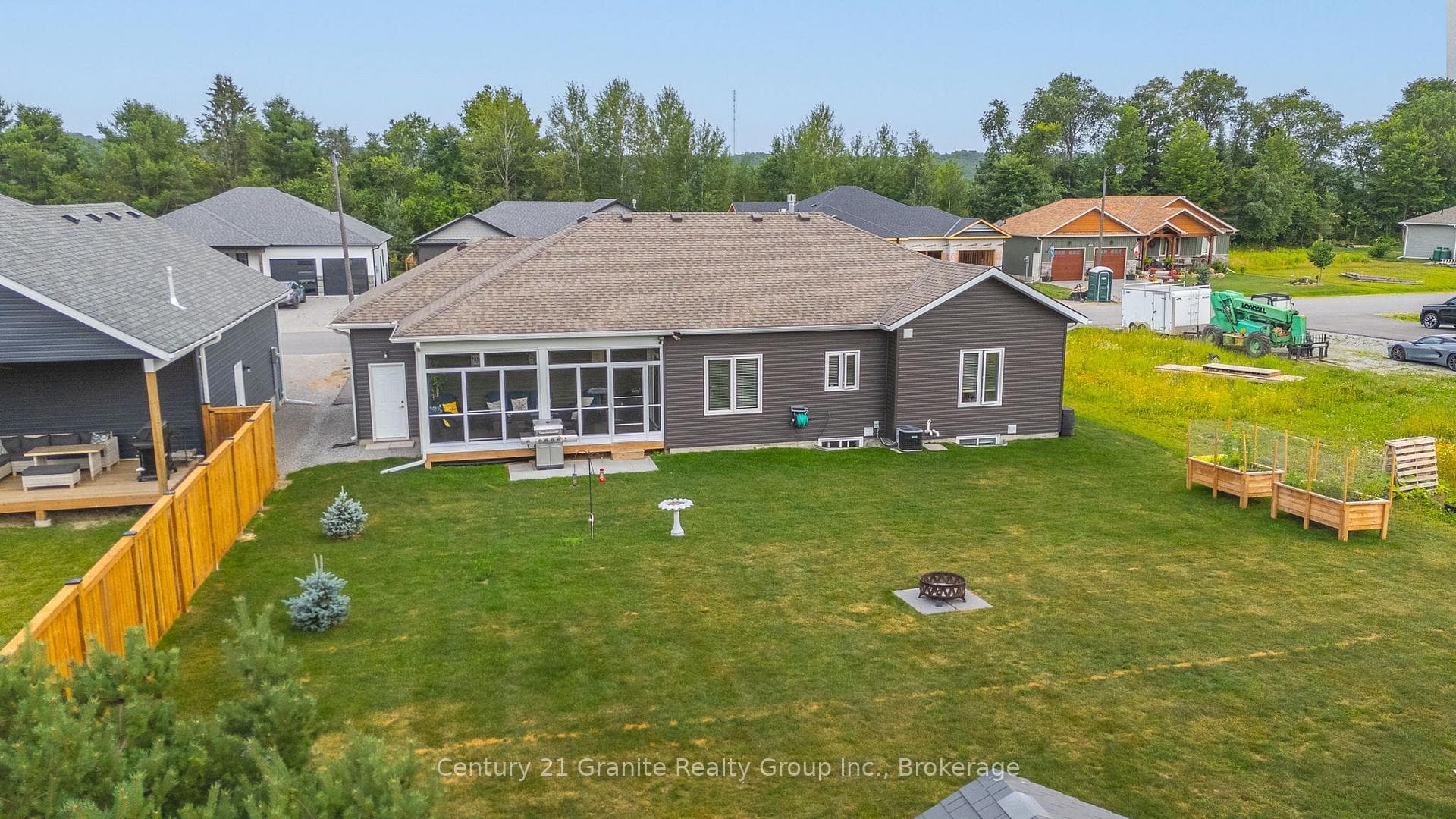 LARGE BACKYARD WITH STORAGE SHEDS/WOOD SHED