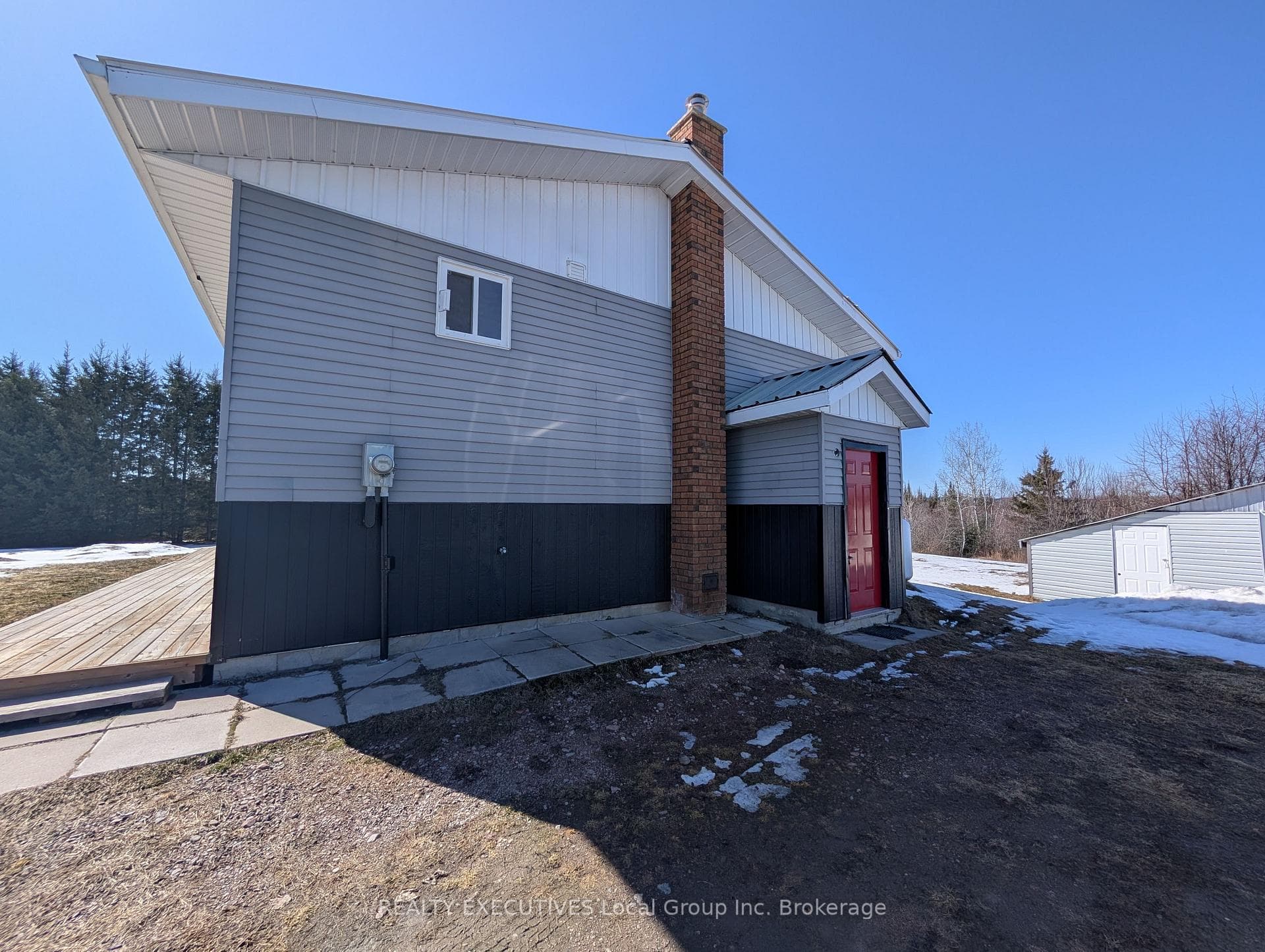 Side entrance to basement utility room.
