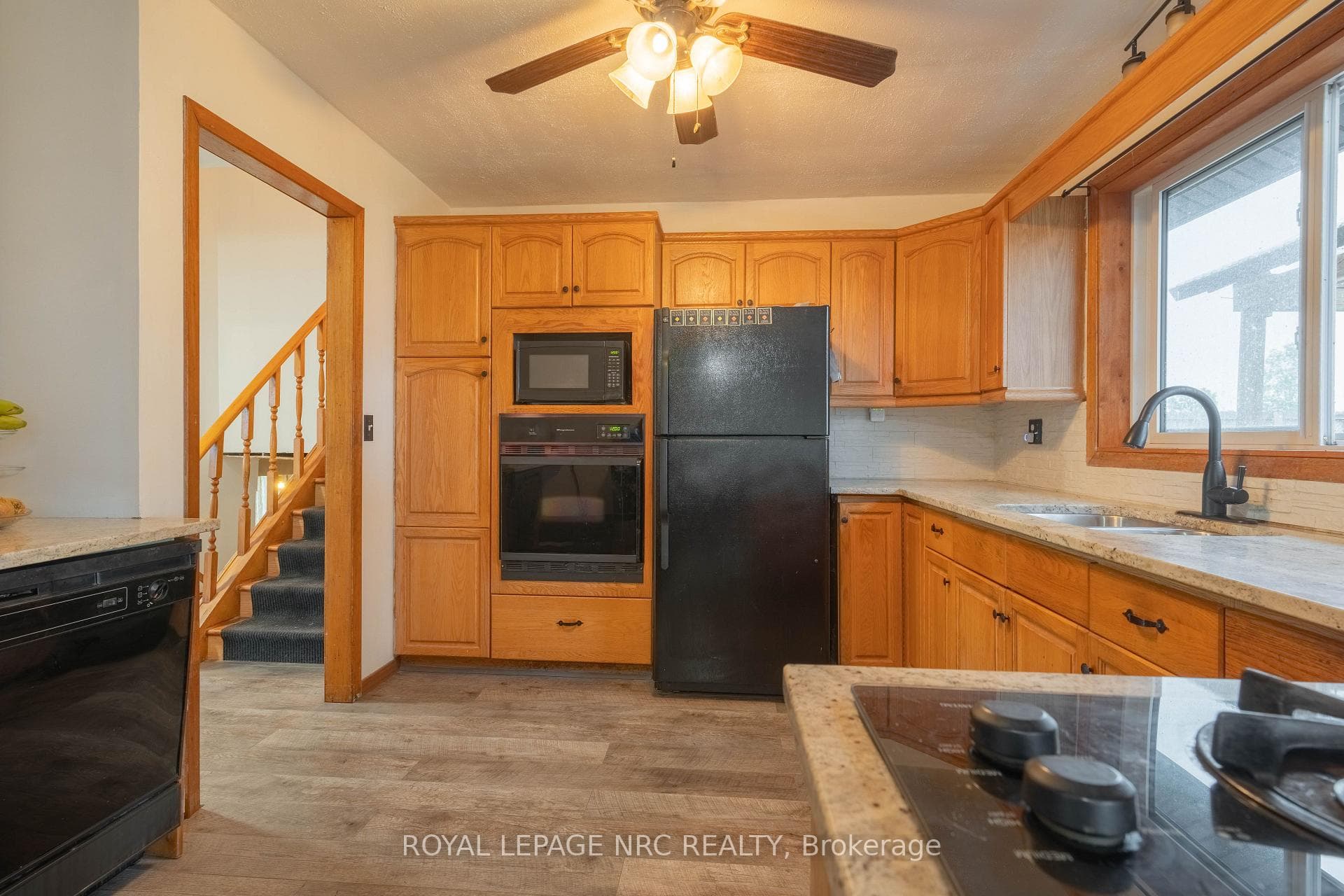 Kitchen with Ample Storage and Granite Counters