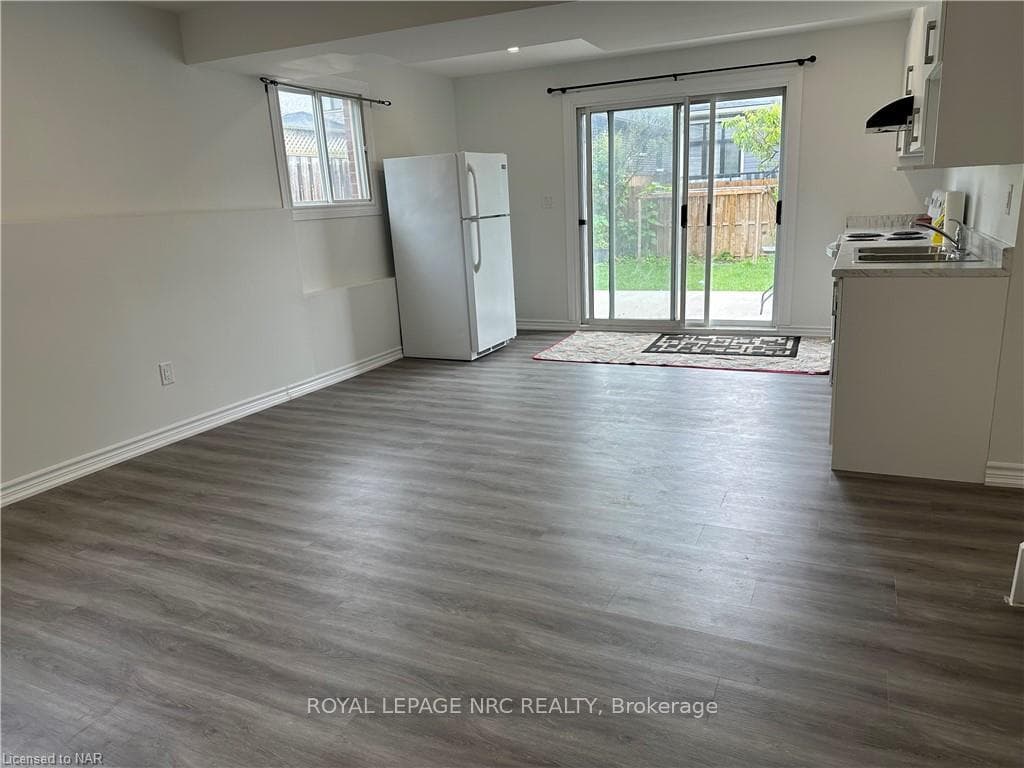 Living/Kitchen with laminate flooring.