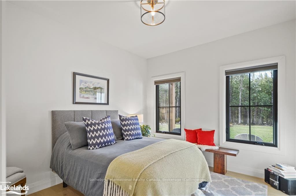 Bedroom featuring wood-type flooring