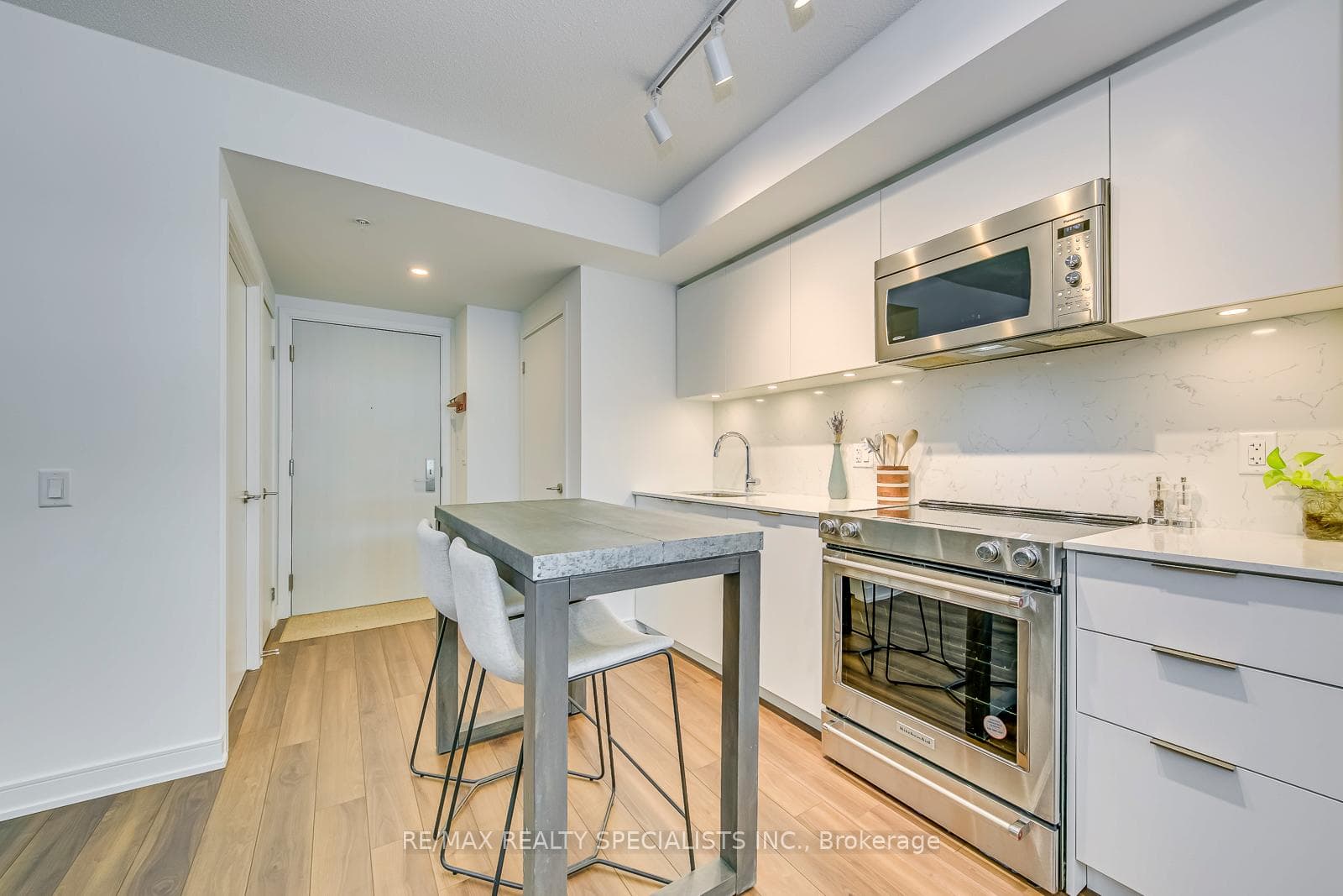 Kitchen space to front entrance view