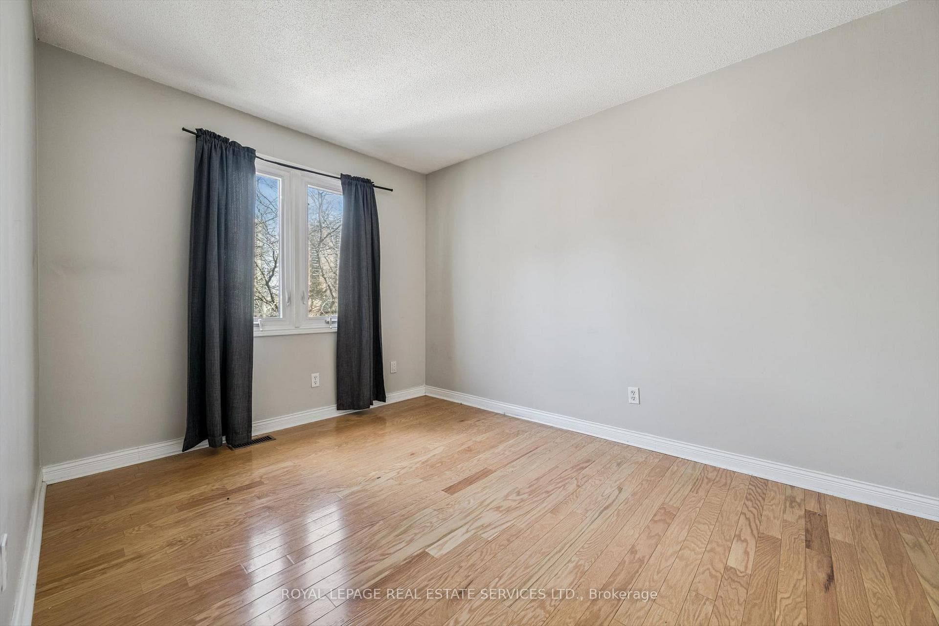 Second Bedroom with Hardwood Flooring