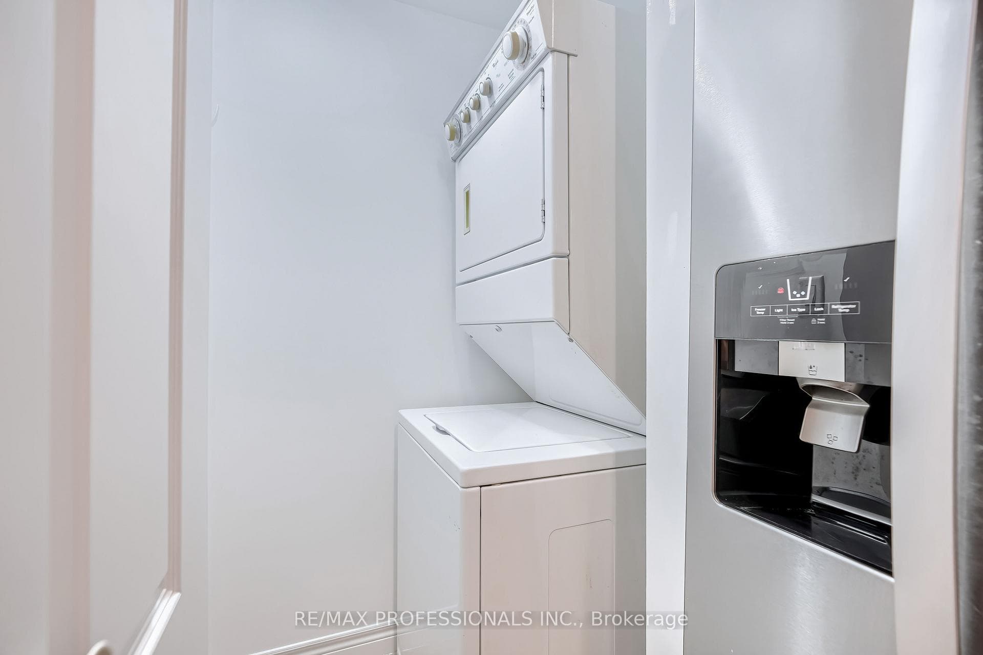 Included Stacked Washer & Dryer off Kitchen