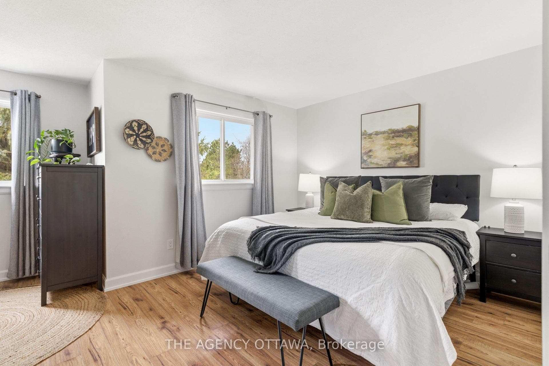 Bright bedroom with new floors & large window