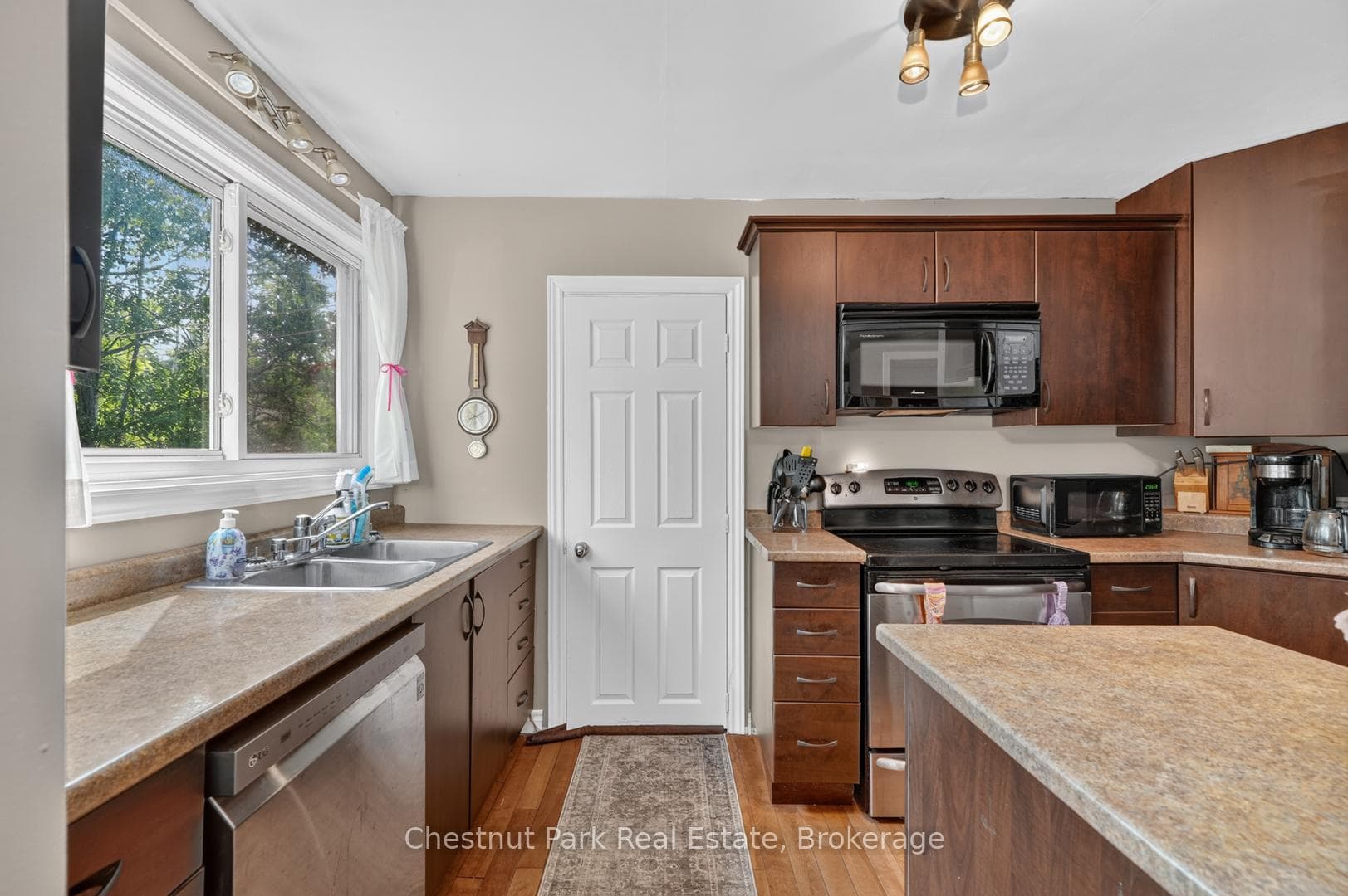 Door to basement, bright kitchen