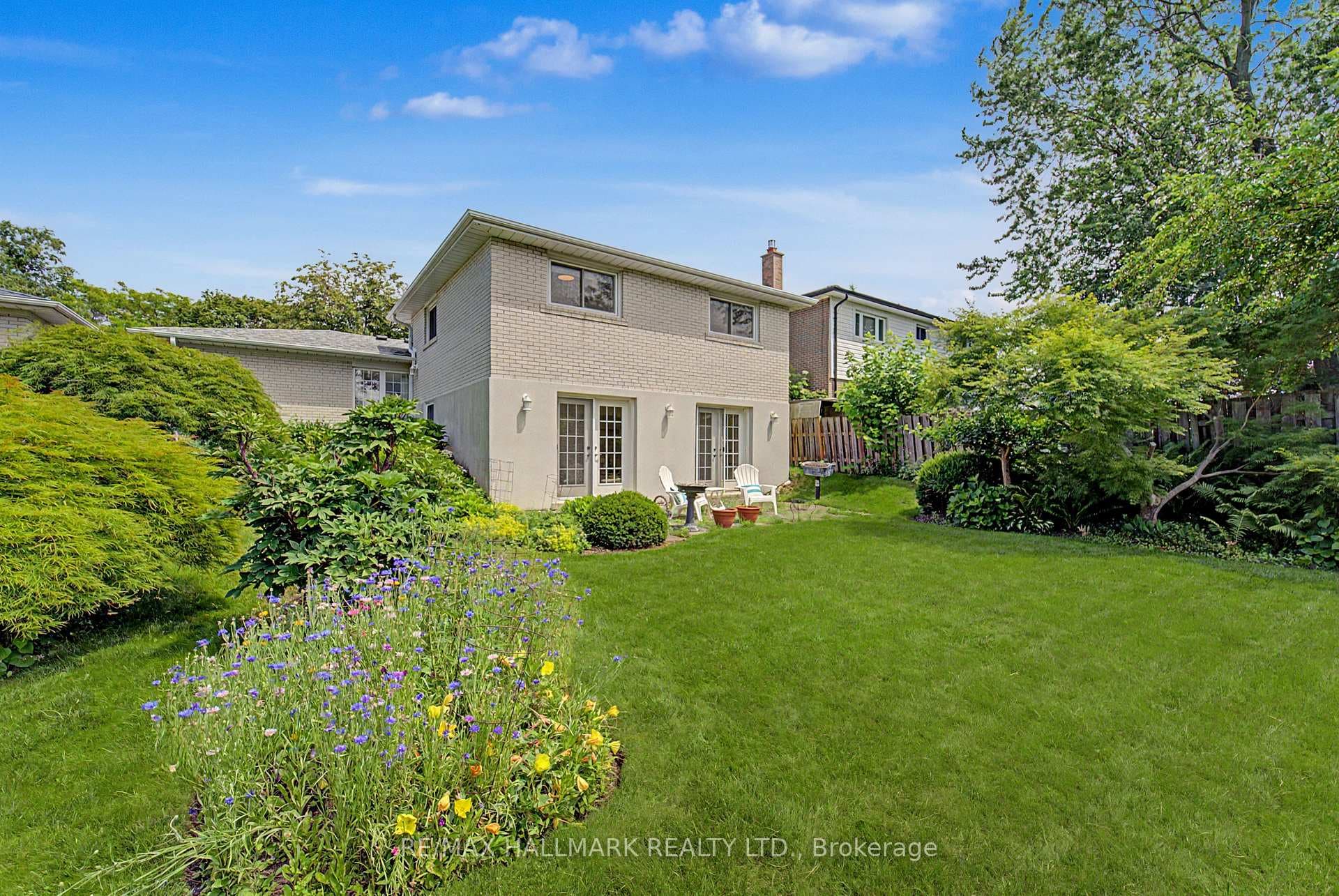 large landscaped fenced yard