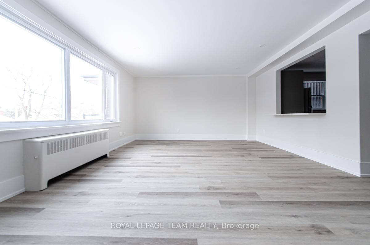 Living/Dining Room with opening to Kitchen